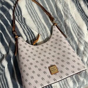 Dooney & Bourke Cream Shoulder Bag with Monogram Pattern and Adjustable Strap